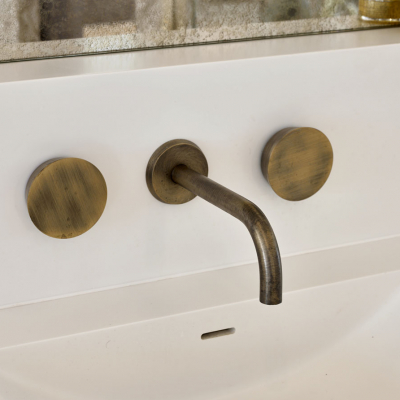 Zen Brass Wall Mounted Basin Tap with Round Handles by The Watermark Collection